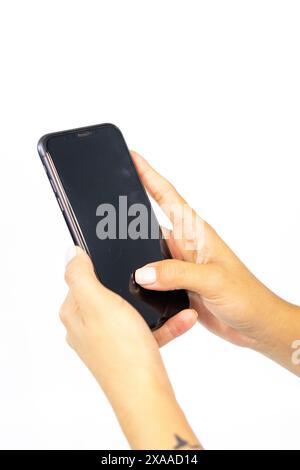 Hands Holding a Smartphone in a Detailed Close-up Shot Stock Photo