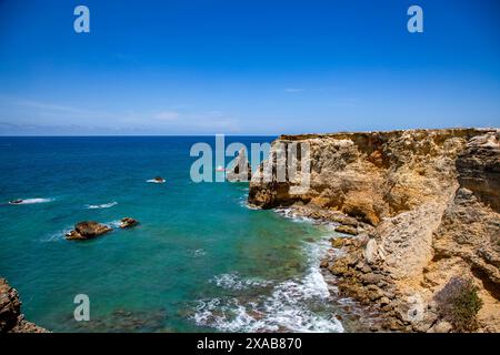 Cabo Rojo's rocky shoreline in Puerto Rico's aqua blue crystal clear atlantic ocean shoreline. Stock Photo