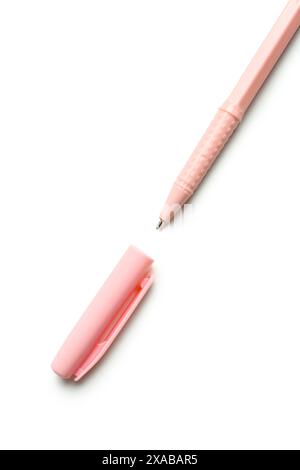 Pink ballpoint pen with cap on white background Stock Photo
