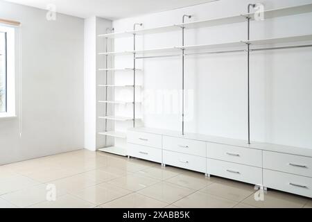 Empty shelves and drawers in modern wardrobe Stock Photo