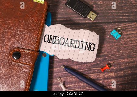 Word writing text Onboarding. Business concept for Action Process of integrating a new employee into an organization Man holding marker notebook page Stock Photo