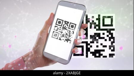 Image of qr code and qr code scanning on smartphone Stock Photo