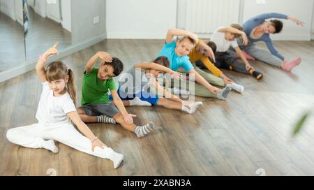 Group of children warming up before dance class Stock Photo
