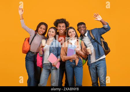 Diverse Group of Students Smiling and Waving Stock Photo