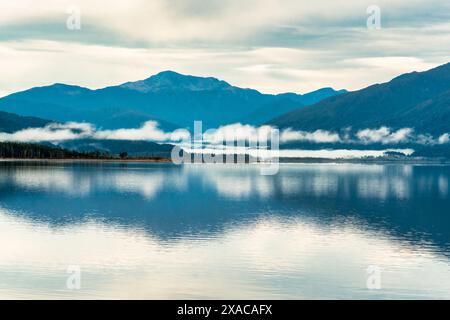 Ethereal blue tones of lake Brunner, West Coast NZ early in the morning Stock Photo
