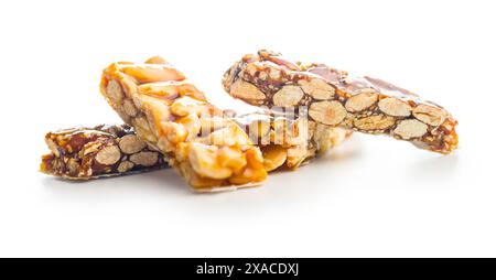 Close Up of almond Brittle Bars With Caramelized Coating isolated on a white background. Stock Photo