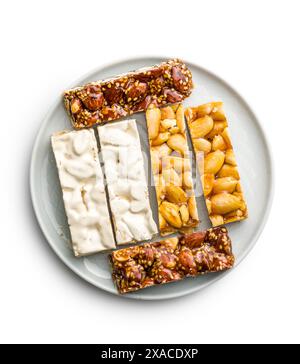 Close Up of almond Brittle Bars With Caramelized Coating isolated on a white background. Stock Photo