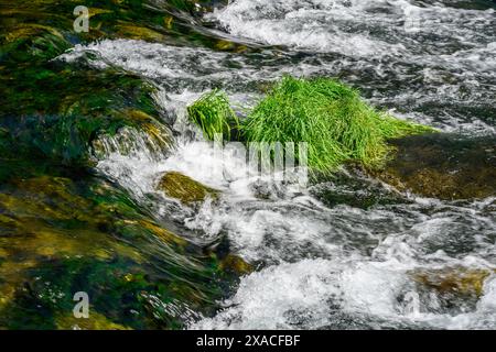 River flowing through rocks photographed with long exposure technique Stock Photo