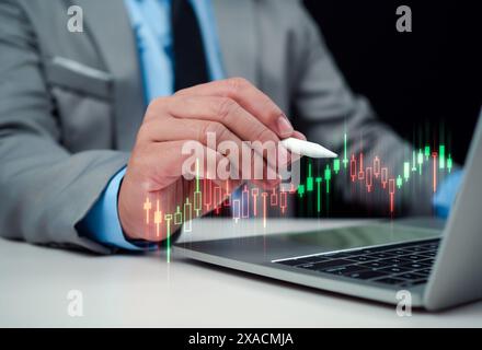 Stock market, Progress or success concept, Business growth, Businessman or trader is showing a growing virtual hologram stock on computer, Planning an Stock Photo