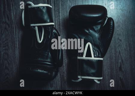 Boxing gloves on a wooden table. High quality photo Stock Photo