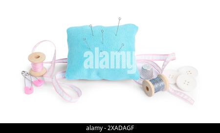 Pincushion, needles and other sewing tools isolated on white Stock Photo