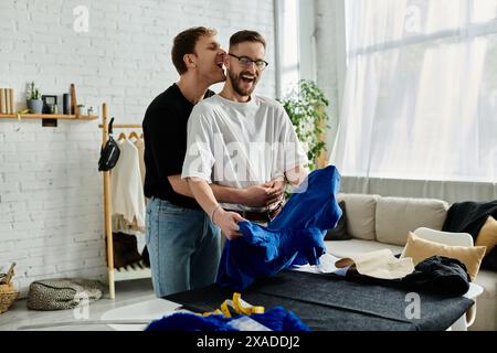 Two men, creatively collaborating in their stylish atelier Stock Photo