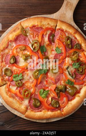 Delicious pizza Diablo on wooden table, top view Stock Photo