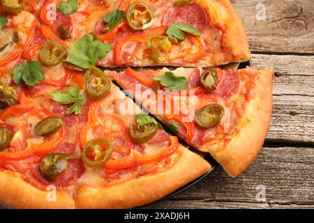 Delicious pizza Diablo on wooden table, closeup Stock Photo