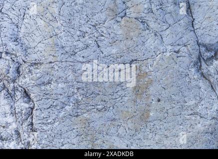 flat photography of a light blue grey granite stone with cracked textured surface Stock Photo