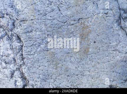 flat photography of a light blue grey granite stone with cracked texture Stock Photo