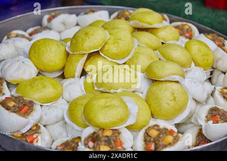 Close-up of stuffed steamed bun in hot pot Stock Photo