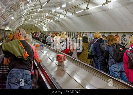 London Underground tube typical escalators tightly packed with passengers Stock Photo