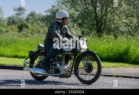 Stony Stratford,UK - June 2nd 2024: 1947 Norton classic motorcycle on a British country road Stock Photo