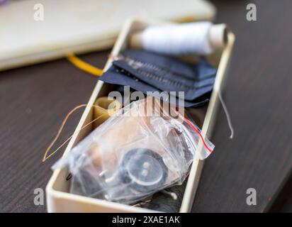 Close up shot of the box with sewing supplies Stock Photo