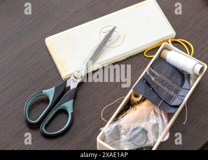 Close up shot of the box with sewing supplies Stock Photo