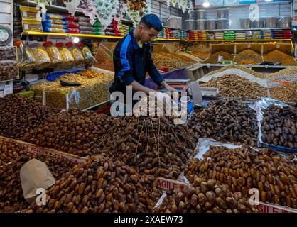 Taroudant, Morocco - 21 March, 2024: shopkeeper selling dates and figs in the souk of the medina in Taroudant Stock Photo