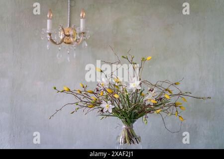 Spring flower arrangement.	Interior design with bouquet spring flowers in vase. Stock Photo