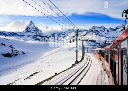 View of the Matterhorn from a window of the cogwheel train of the Gornergrat Railway descending towards Zermatt in the Swiss Alps in winter, Canton of Stock Photo