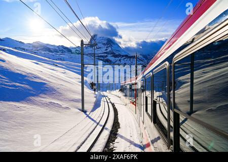 View of the Matterhorn from a window of the cogwheel train of the Gornergrat Railway descending towards Zermatt in the Swiss Alps in winter, Canton of Stock Photo