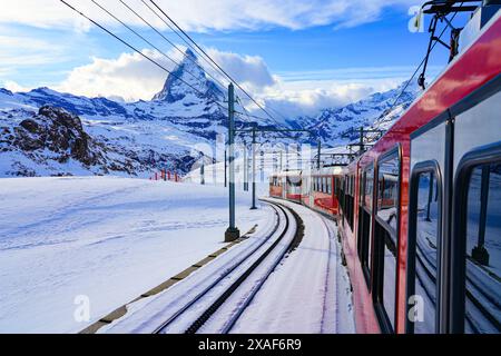 View of the Matterhorn from a window of the cogwheel train of the Gornergrat Railway descending towards Zermatt in the Swiss Alps in winter, Canton of Stock Photo