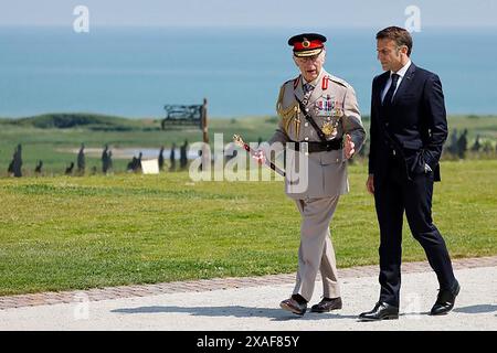 Normandy, France. 06th June, 2024. France's President Emmanuel Macron (R) greets Britain's King Charles III during the UK Ministry of Defence and the Royal British Legion's commemorative ceremony marking the 80th anniversary of the World War II 'D-Day' Allied landings in Normandy, at the World War II British Normandy Memorial near the village of Ver-sur-Mer in northwestern France, on June 6, 2024. Photo by Embassy France in U.S/UPI. Credit: UPI/Alamy Live News Stock Photo