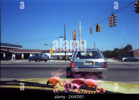 cars crossic traffic light during Daytona Bike Week in March of 1986 , Daytona beach, Florida, USA *** cars crossing traffic light during Daytona Bike Week in March of 1986 , Daytona beach, Florida, USA Stock Photo