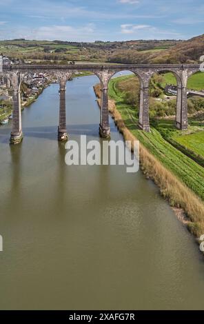 An aerial view of a 19th century railway viaduct crossing a river valley, over the River Tamar, at Calstock, near Gunnislake, Cornwall, Great Britain. Stock Photo