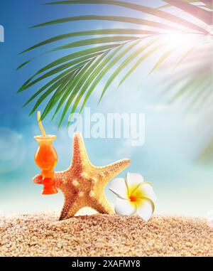 Starfish and palm on the sandy beach. Summer time. Summer concept. Stock Photo