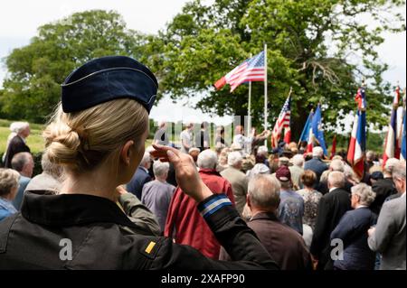 Magneville, France. 03 June, 2024. U.S Air Force 2nd Lt. Madison Marsh, crowned Miss America 2024, salutes during the Commemoration of the American Air Force planes that Crashed during D-Day, June 3, 2024, in Magneville, Normandy, France. Marsh, a 22-year-old U.S. Air Force Academy graduate is the first active duty military officer to hold the crown as Miss America.  Credit: Miriam Thurber/U.S Air Force Photo/Alamy Live News Stock Photo