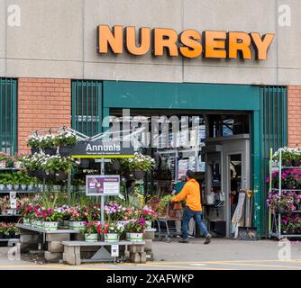 Customers entering the garden center at a Home Depot Stock Photo