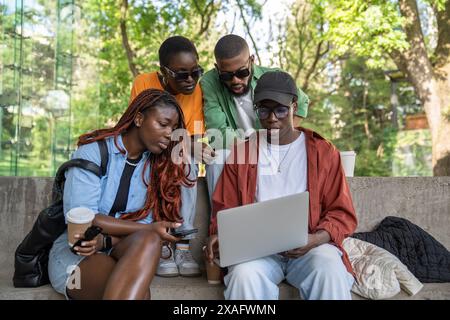 Group of African American student friends working together on education project, presentation. Stock Photo