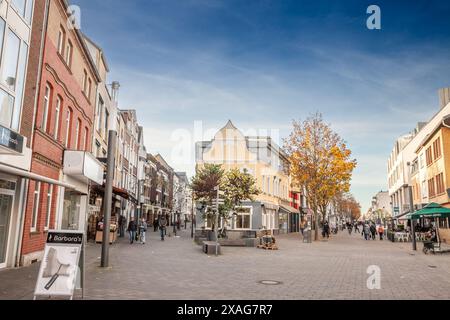 Picture of the main street of Troisdorf, Kolner strasse, with shops and stores while people are passing by. Troisdorf is a city in the Rhein-Sieg-Krei Stock Photo