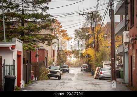 Picture of a street of Cote des Neiges, in Montreal, in a residential, poor area of the city of Quebec, under the rainA dilapidated residential street Stock Photo