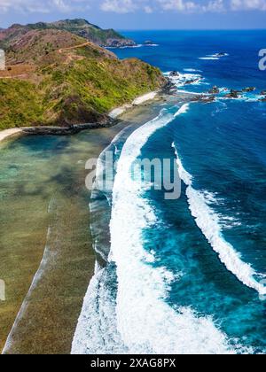 Aerial view of ocean waves breaking with white foam and turquoise water ...