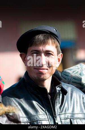 Portrait of an Uyghur man taken in the old city of Kashgar, Xinjiang, China. Stock Photo