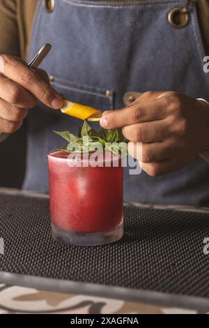 Drinks in a bar and barman Stock Photo