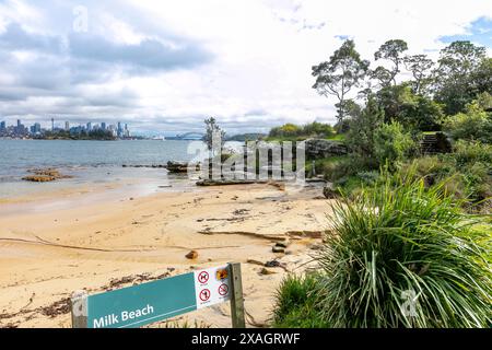 Milk Beach in Vaucluse Sydney eastern suburbs, small secluded harbour beach with view of Sydney city centre and Sydney harbour bridge,NSW,Australia Stock Photo