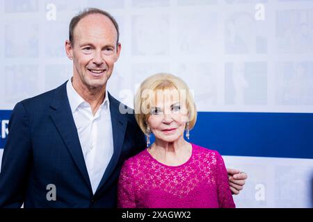 Berlin, Germany. 06th June, 2024. Liz Mohn, shareholder of Bertelsmann Verwaltungsgesellschaft and member of the Bertelsmann Supervisory Board, and Thomas Rabe, Chairman of the Bertelsmann Executive Board and CEO of RTL Group, attend the Bertelsmann Party at the Bertelsmann Representative Office. Traditionally, Liz Mohn, her family and the Bertelsmann CEO welcome guests from the worlds of politics, entertainment and business to the capital. Credit: Christoph Soeder/dpa/Alamy Live News Stock Photo