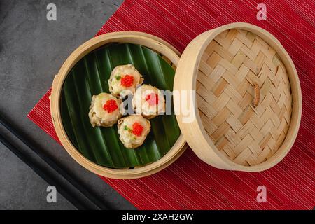 Shumai with shrimp and mushrooms, a traditional Chinese dumpling often served with dim sum Stock Photo