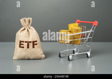 Exchange traded fund and shopping cart with money coins. ETF. Invest on the stock exchange. Receive dividends and profits. Business and trade. Stock Photo