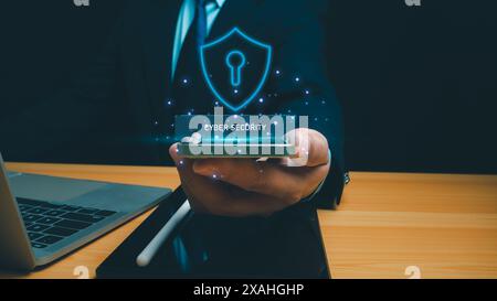 Cyber security technology concept, Businessman use phone and computer online showing protection icons cyber espionage, Represents the code protection, Stock Photo