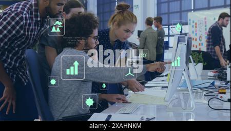 Image of eco icons and data processing over diverse business people in office Stock Photo