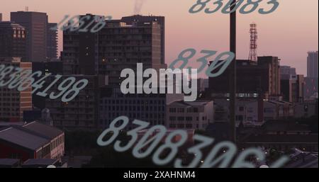 Image of numbers and data processing over cityscape Stock Photo