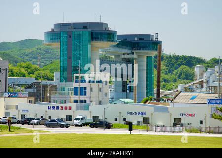 Samcheok City, South Korea - May 18th, 2024: View of the Samcheok Port Earthquake and Tsunami Safety Tower from Isabu Plaza. The modern structure stan Stock Photo